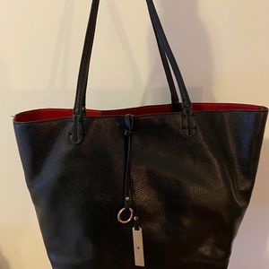 Black purse with red interior